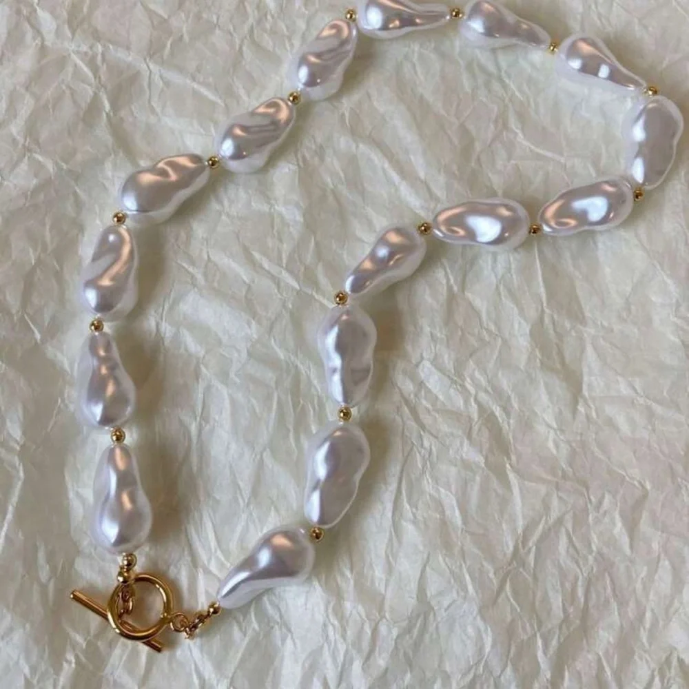 Elegant Pearl Necklace with Gold Accents